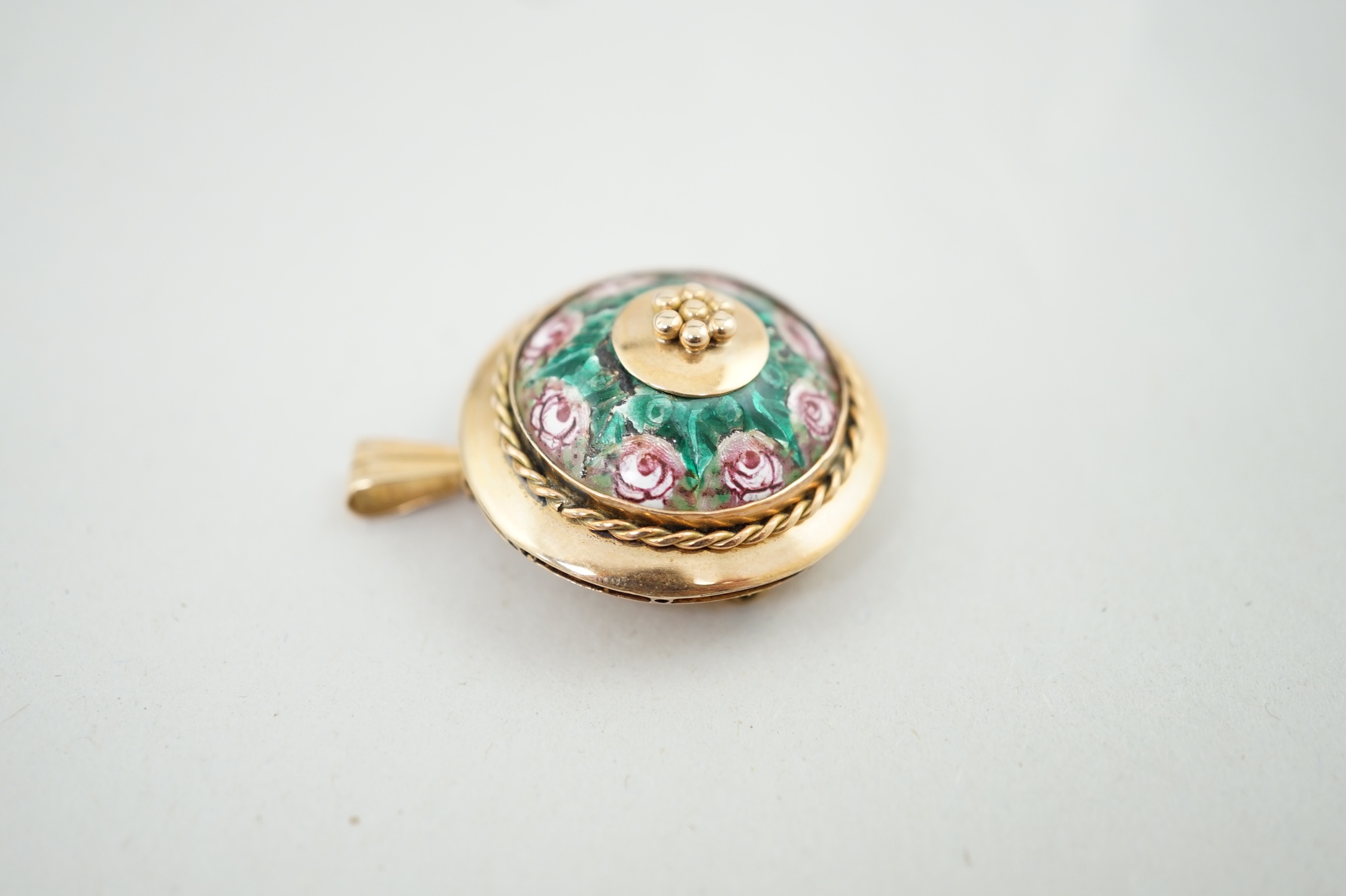 A mid 20th century 14k gold and two colour enamel set circular pendant brooch